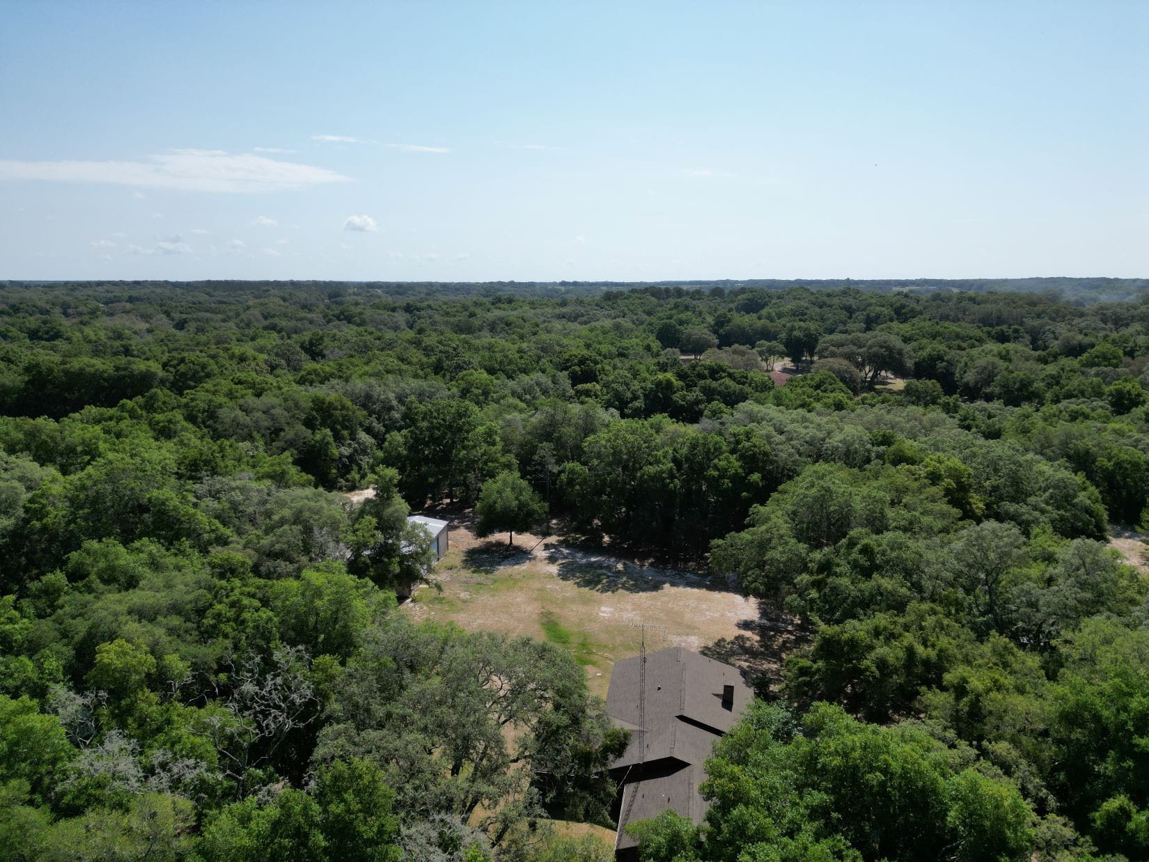 This beautiful property high and dry, fenced, partially cleared, partially wooded