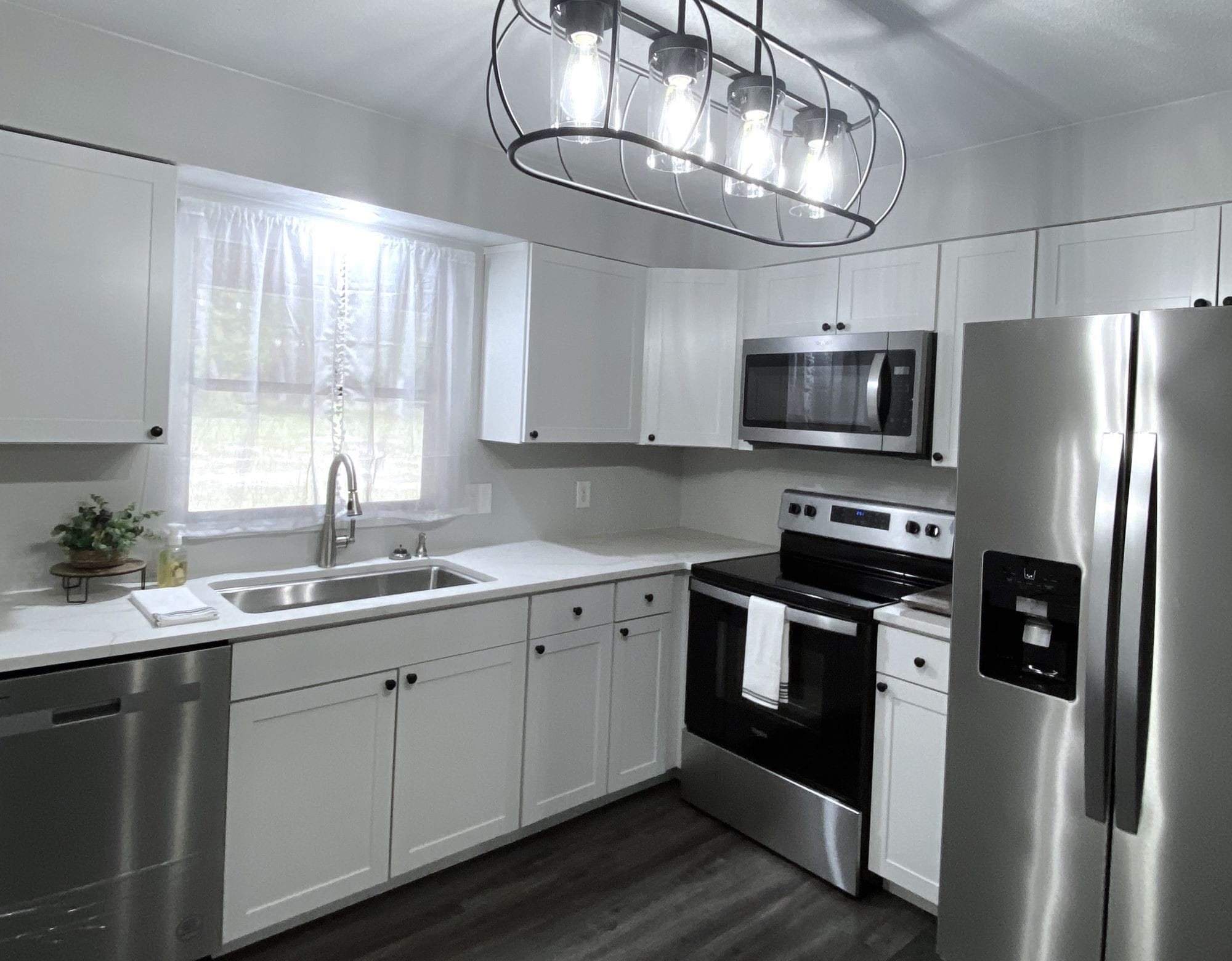 New cabinets, New appliances, New Fixtures, New quartz counter-tops, New flooring